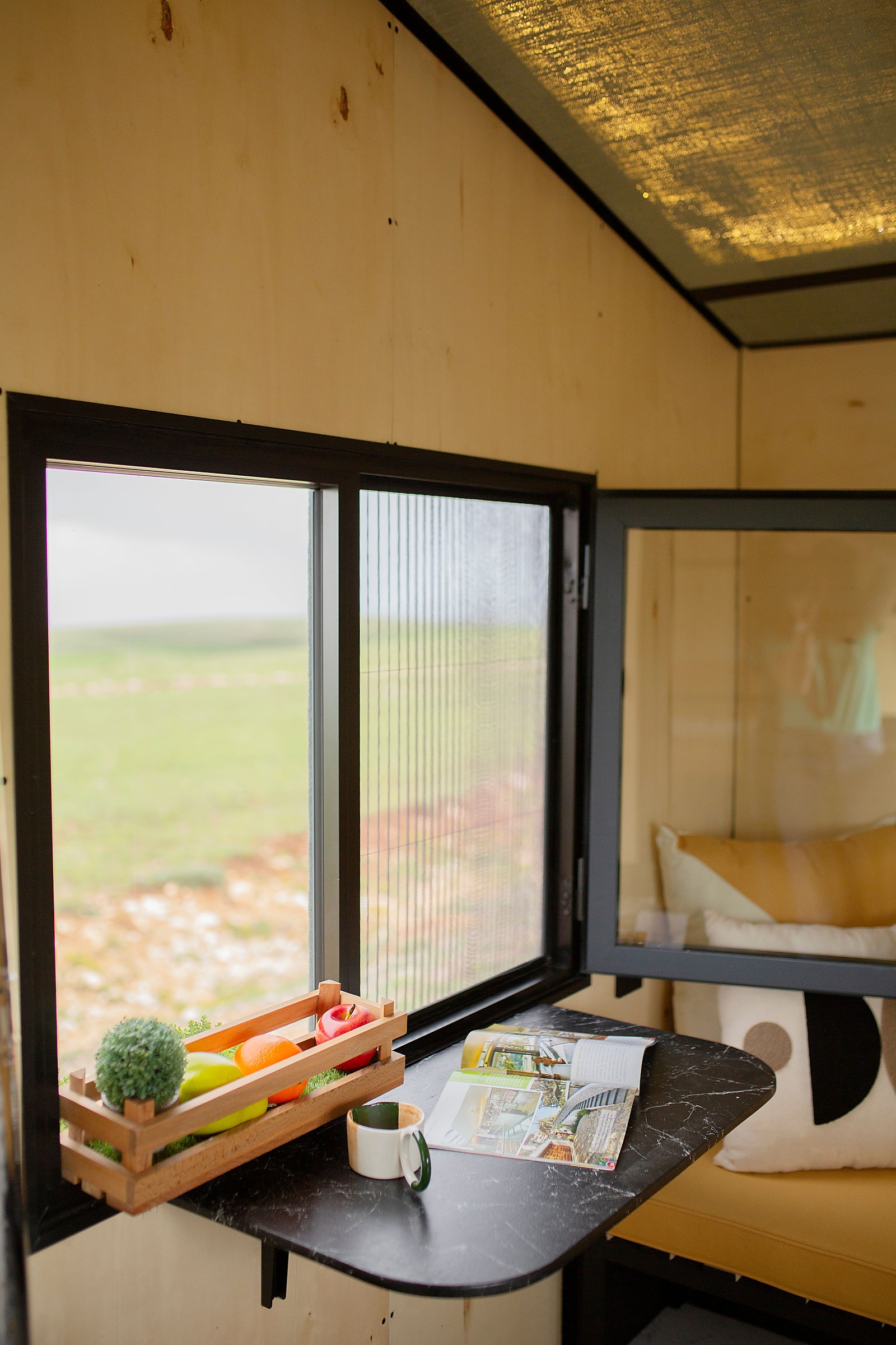 Tiny home window nook with built-in seating